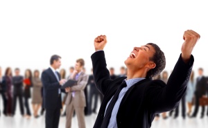very happy energetic businessman with his arms raised